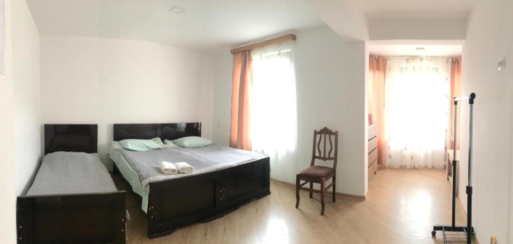 Postel nebo postele na pokoji v ubytování Zviad Guest House