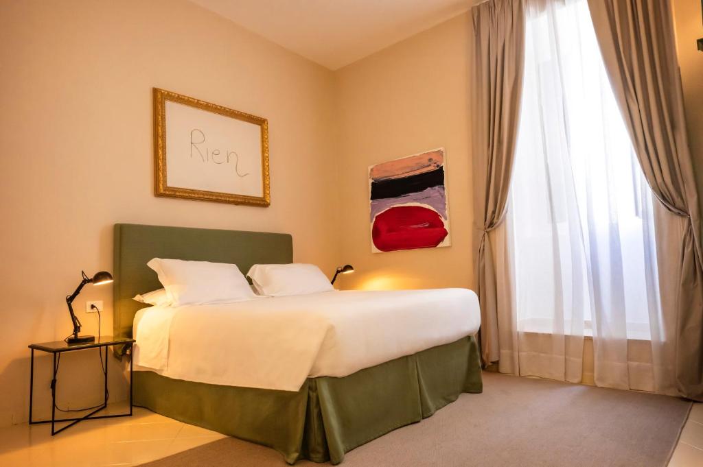 Postel nebo postele na pokoji v ubytování Aria Rooms and Terrace