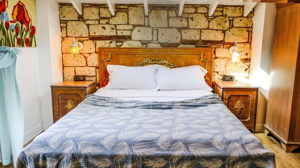 Postel nebo postele na pokoji v ubytování CASA RUBİNO BUTİK OTEL