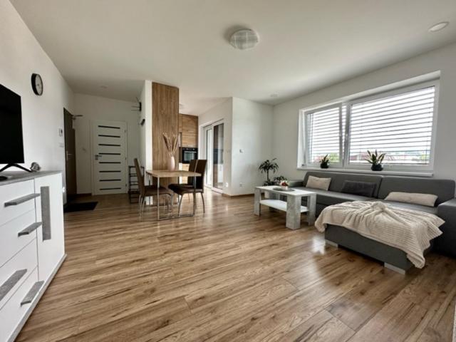 a living room with a couch and a table at Tower Apartments Centrum in Spišská Nová Ves