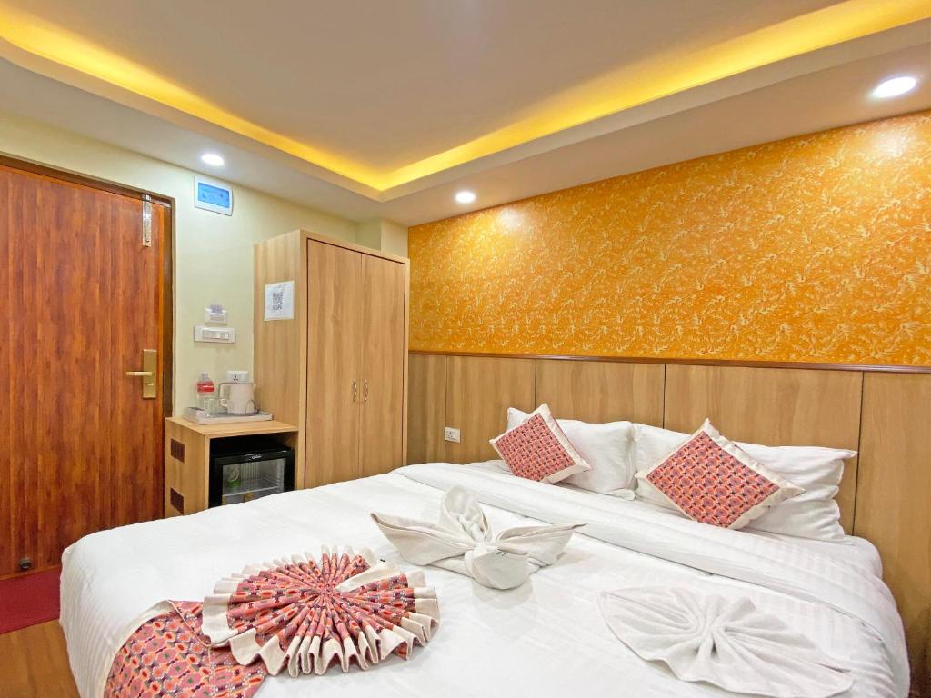 Postel nebo postele na pokoji v ubytování Hotel Lumbini Airport