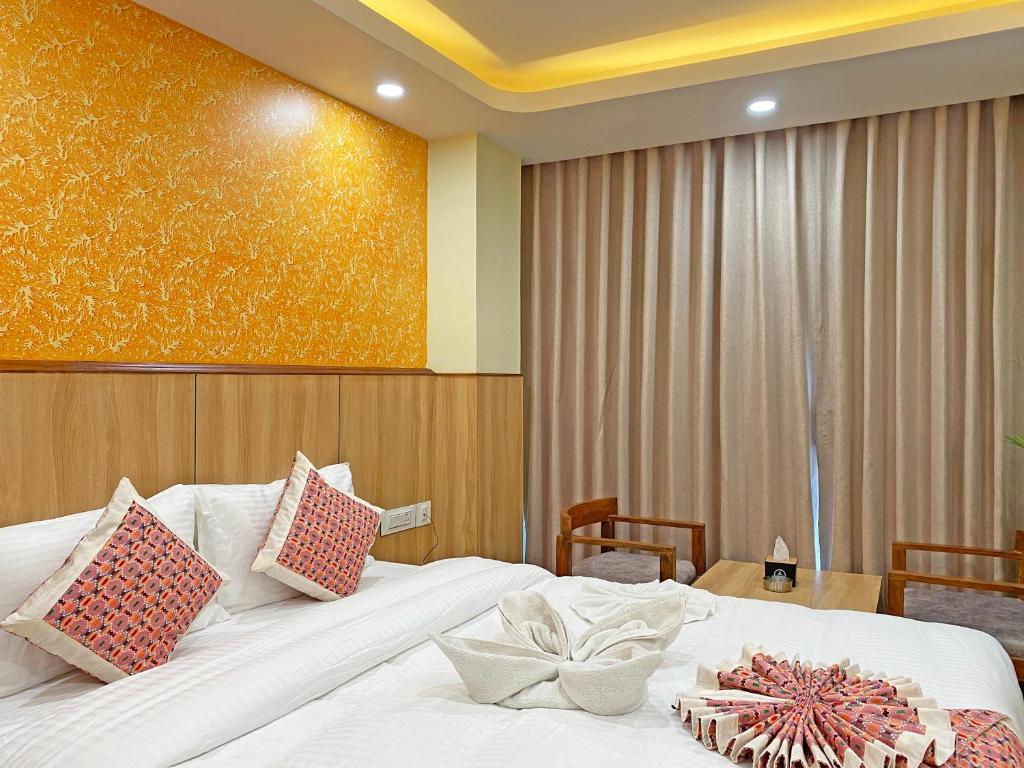 Postel nebo postele na pokoji v ubytování Hotel Lumbini Airport