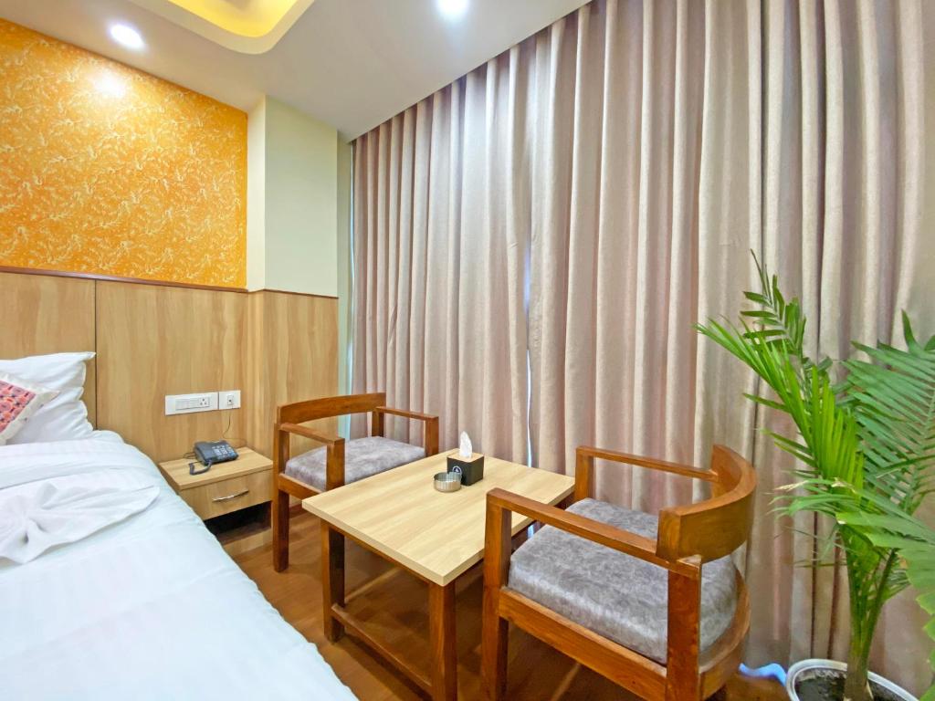 Postel nebo postele na pokoji v ubytování Hotel Lumbini Airport