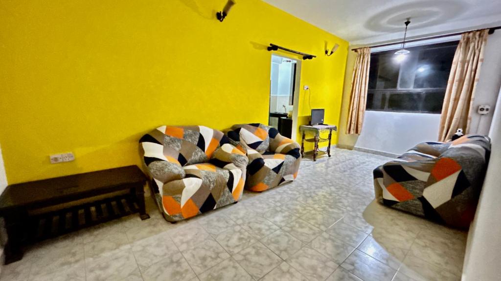 Posezení v ubytování Muffys Pool Apartment