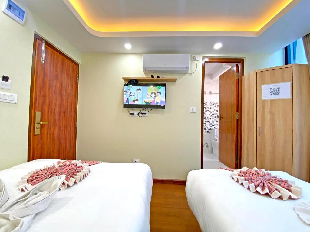 Postel nebo postele na pokoji v ubytování Hotel Lumbini Airport