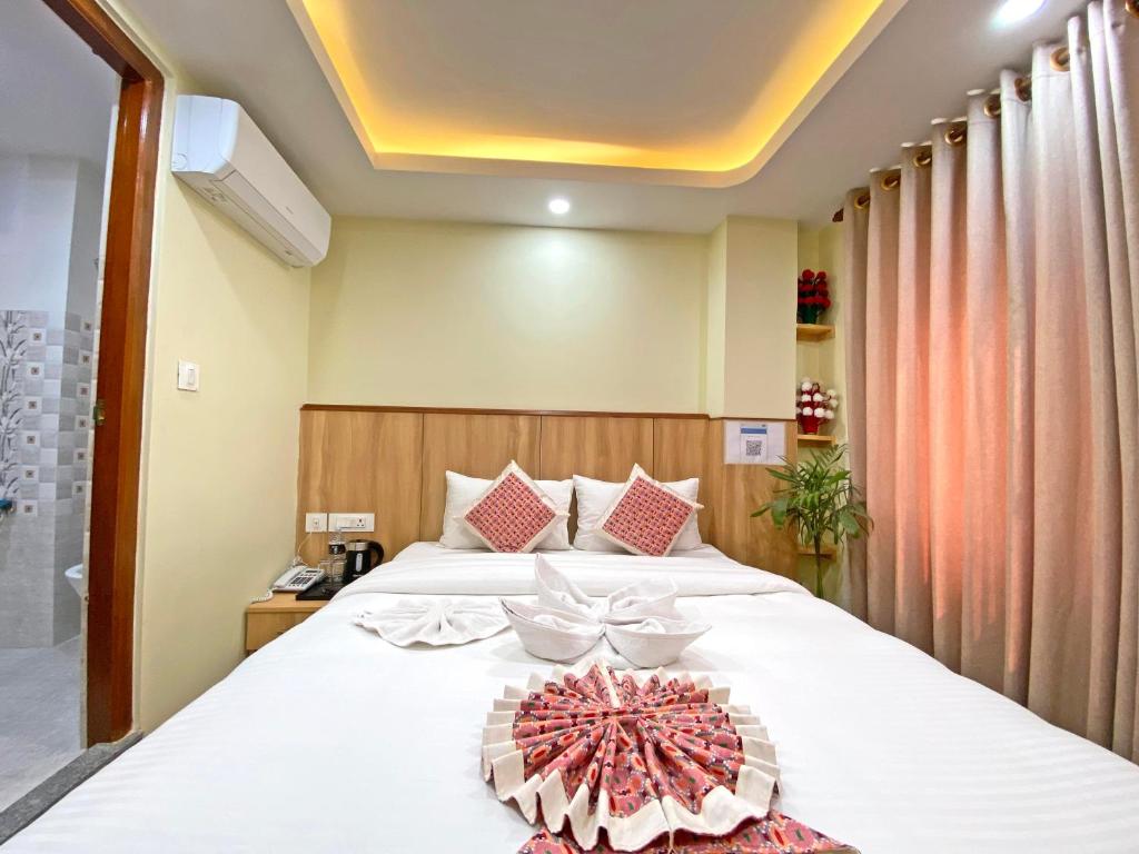 Postel nebo postele na pokoji v ubytování Hotel Lumbini Airport
