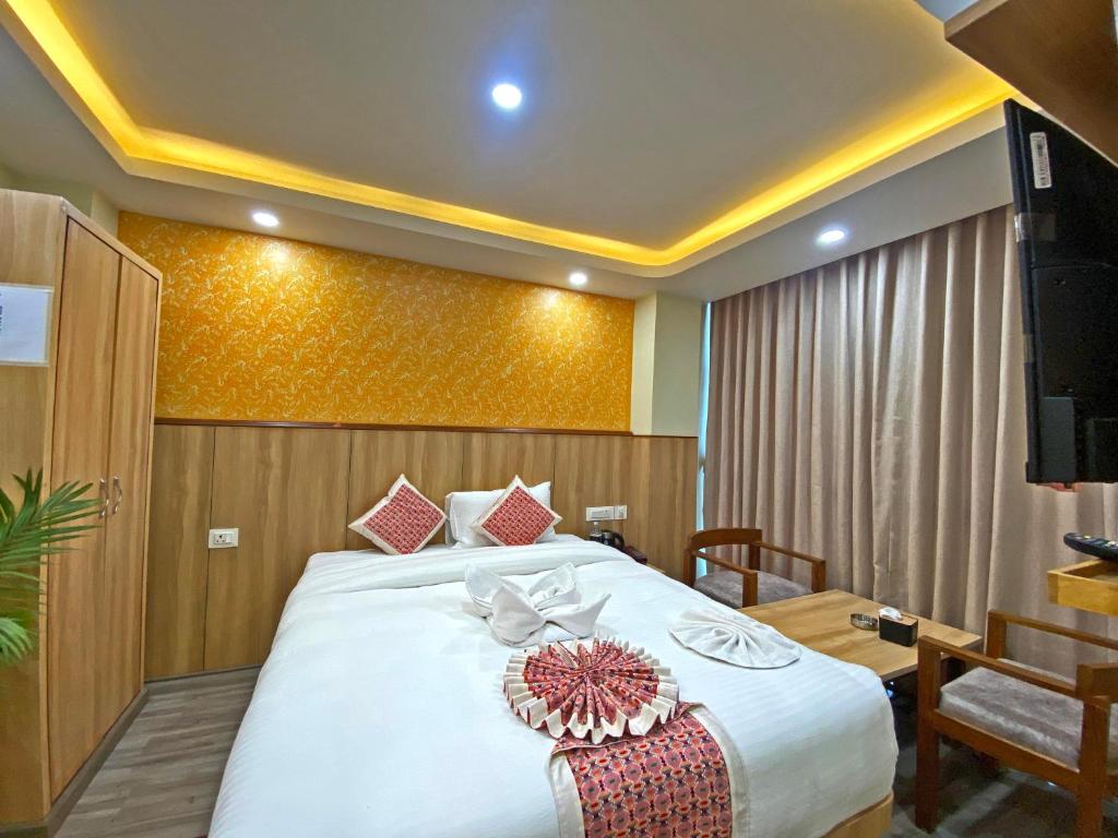 Postel nebo postele na pokoji v ubytování Hotel Lumbini Airport