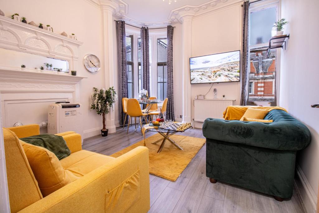 a living room with a couch and a table at Prestigious Apartment on Oxford Street - 3 Bedroom 7GC in London