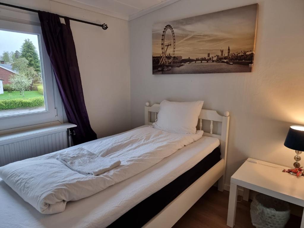 Postel nebo postele na pokoji v ubytování Guest House Tidaholm