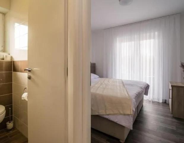 Voodi või voodid majutusasutuse Rooms & Apartment Mama Mia toas