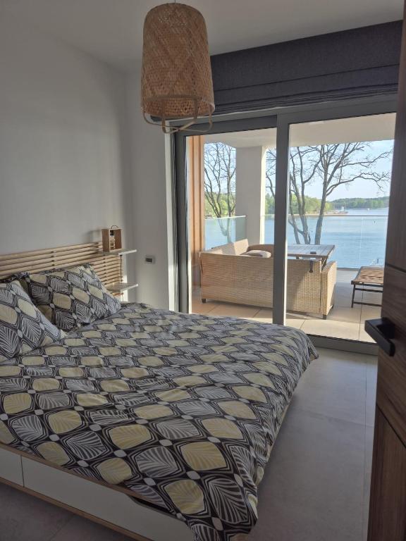 Posteľ alebo postele v izbe v ubytovaní LOFT STRANDA