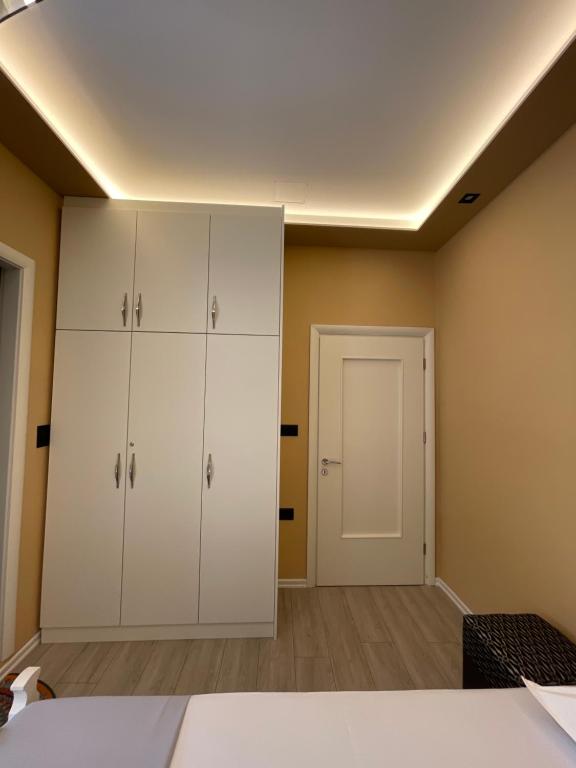 Postel nebo postele na pokoji v ubytování Latifi Guesthouse