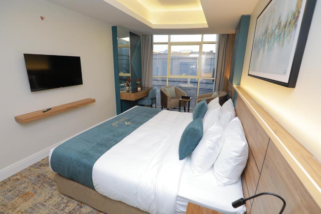 Postel nebo postele na pokoji v ubytování Aluya Hotel