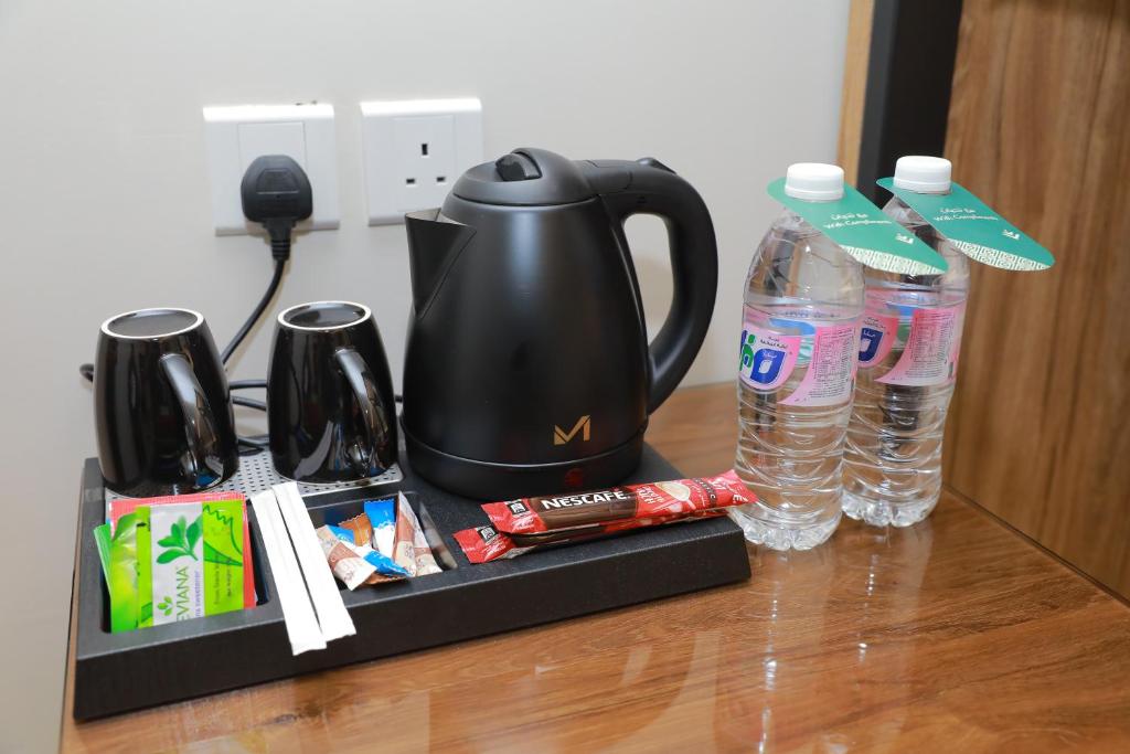 Příslušenství pro přípravu čaje a kávy v ubytování Aluya Hotel