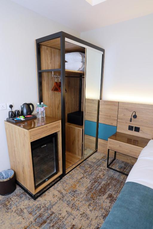 Postel nebo postele na pokoji v ubytování Aluya Hotel