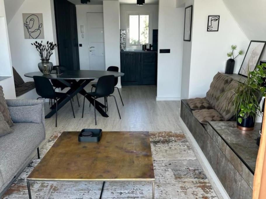 a living room with a couch and a table at Seaview Dreams Luxury 2 bedroom apartment with amazing views and balcony BY NAMASTE ELITE in Torremolinos