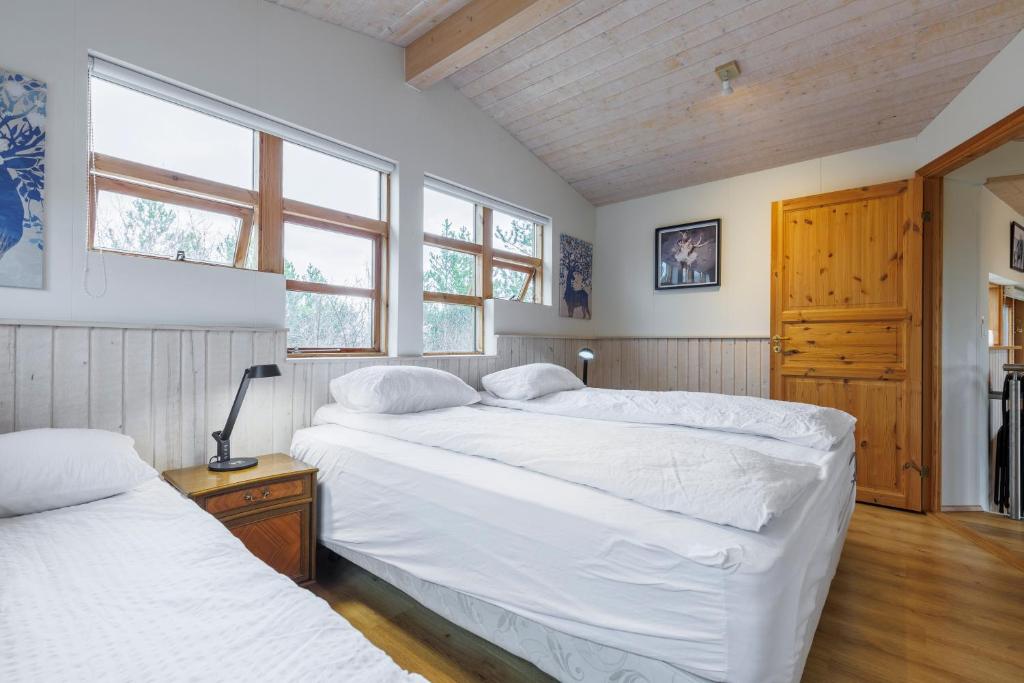 Postel nebo postele na pokoji v ubytování Cabin Úthlíð - Birta Rentals
