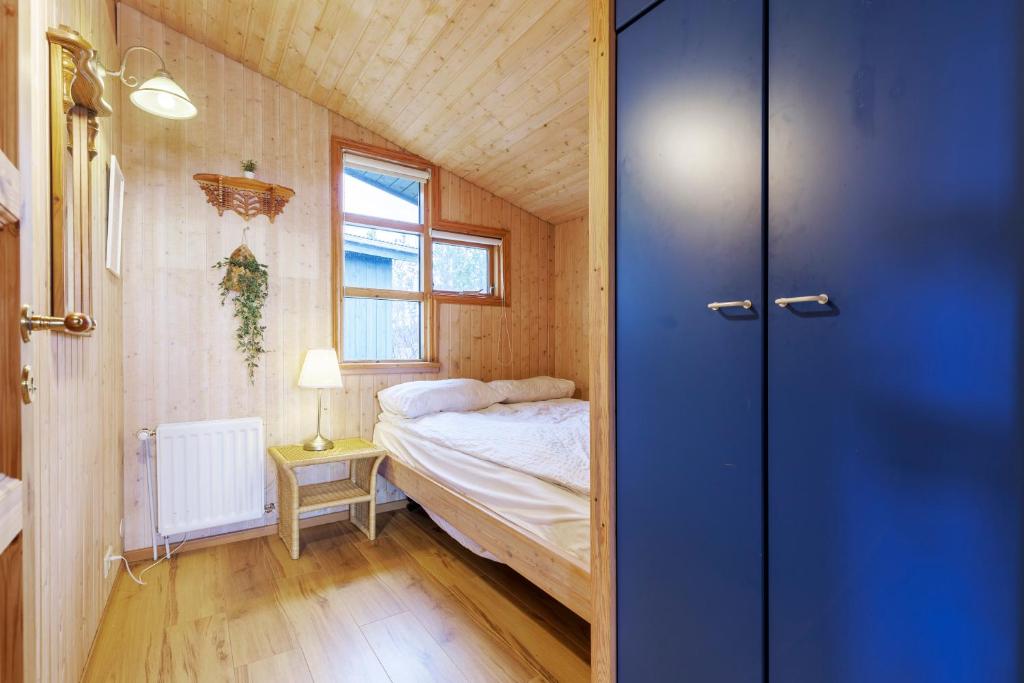 Postel nebo postele na pokoji v ubytování Cabin Úthlíð - Birta Rentals