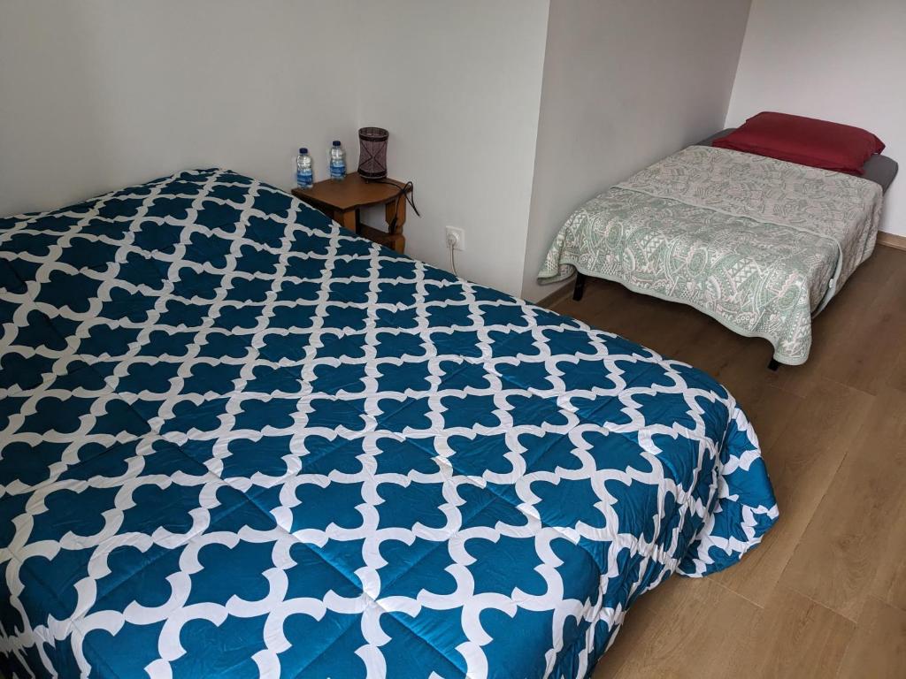 Letto o letti in una camera di Chez Cornélia