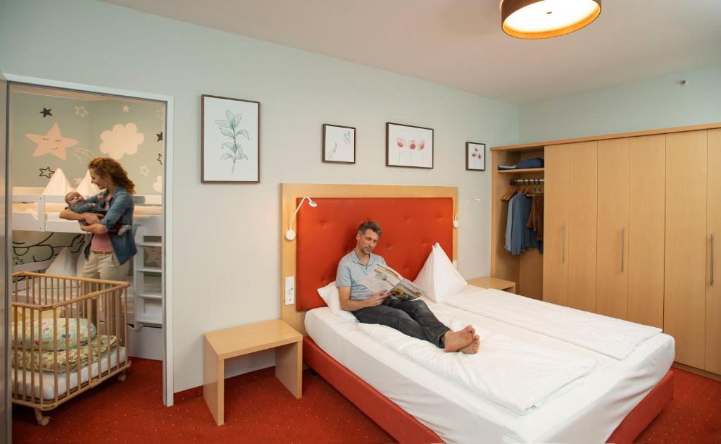 Postel nebo postele na pokoji v ubytování Hotel Sonnenpark & Therme included - auch am An- & Abreisetag!