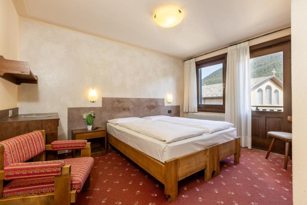Postel nebo postele na pokoji v ubytování Hotel Cardo