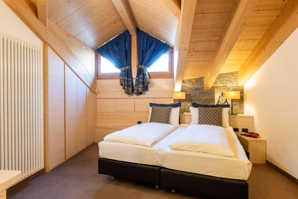 Postel nebo postele na pokoji v ubytování Hotel Cardo