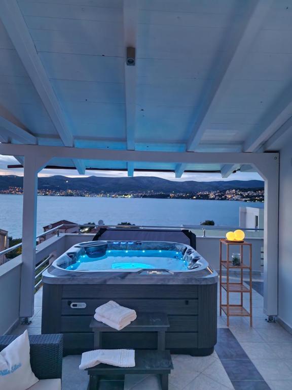 a jacuzzi tub on the deck of a boat at Luxury Apartments Silva with sea view in Trogir