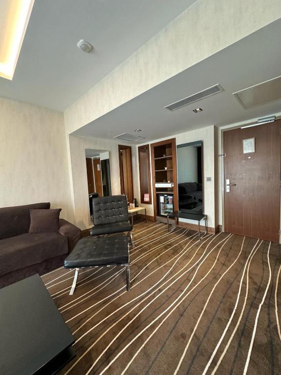 a living room with a couch and chairs in it at Cihangir Hotel Bosphorus in Istanbul