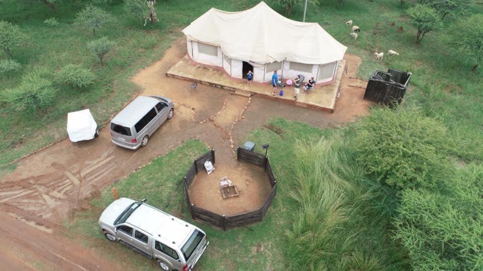 an aerial view of a van parked in front of a tent at Luxury Tents Belabela Resort Warmbath in Bela-Bela