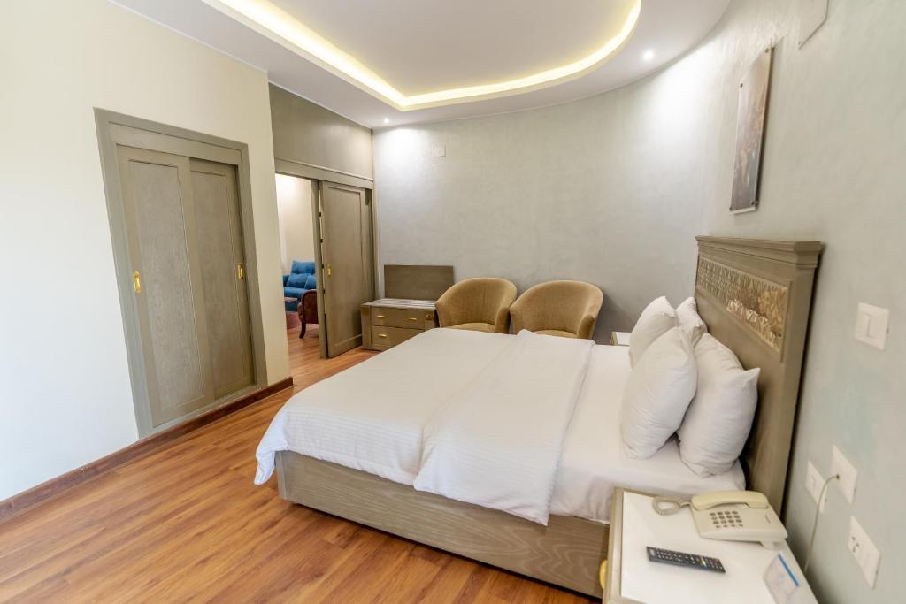 A bed or beds in a room at Lotus Luxor Hotel