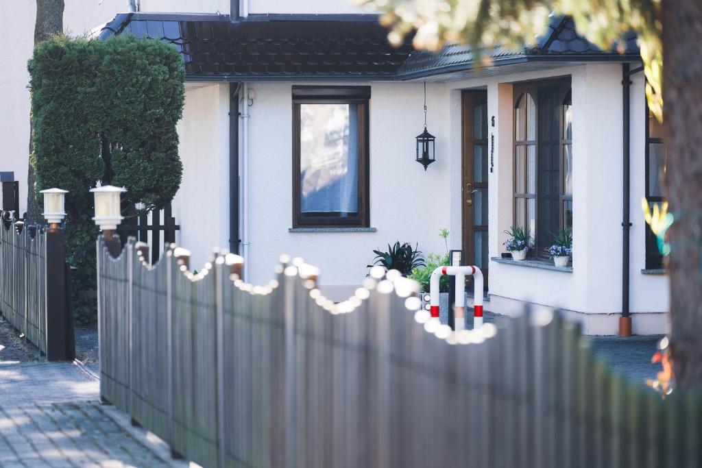 a fence in front of a house at Pension Heinrich Heine in Lutherstadt Wittenberg
