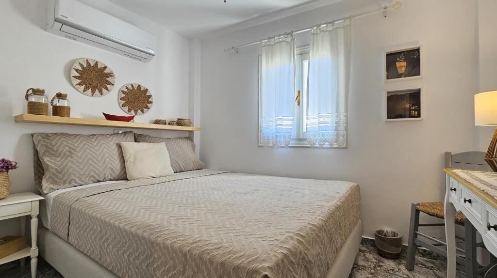 Postel nebo postele na pokoji v ubytování Rinio House in Adamas