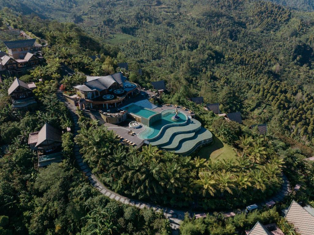 an aerial view of a resort with a swimming pool at Elevate Bali in Munduk