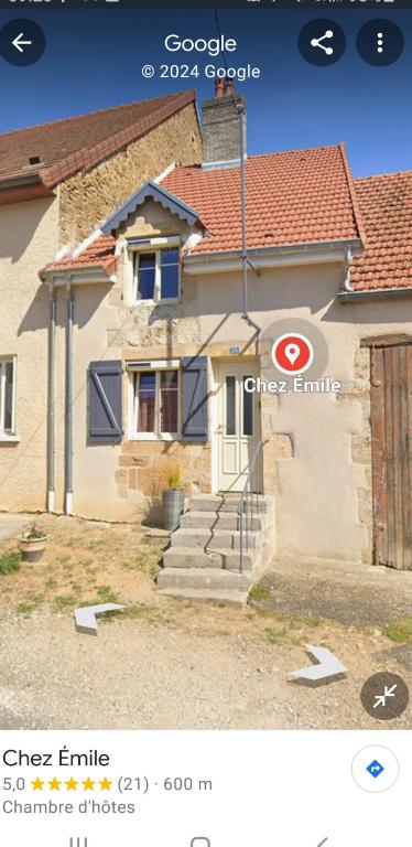 a picture of a house with a sign in front of it at Chez Émile maison d'hotes 2 chambres avec jardin privé in Humes