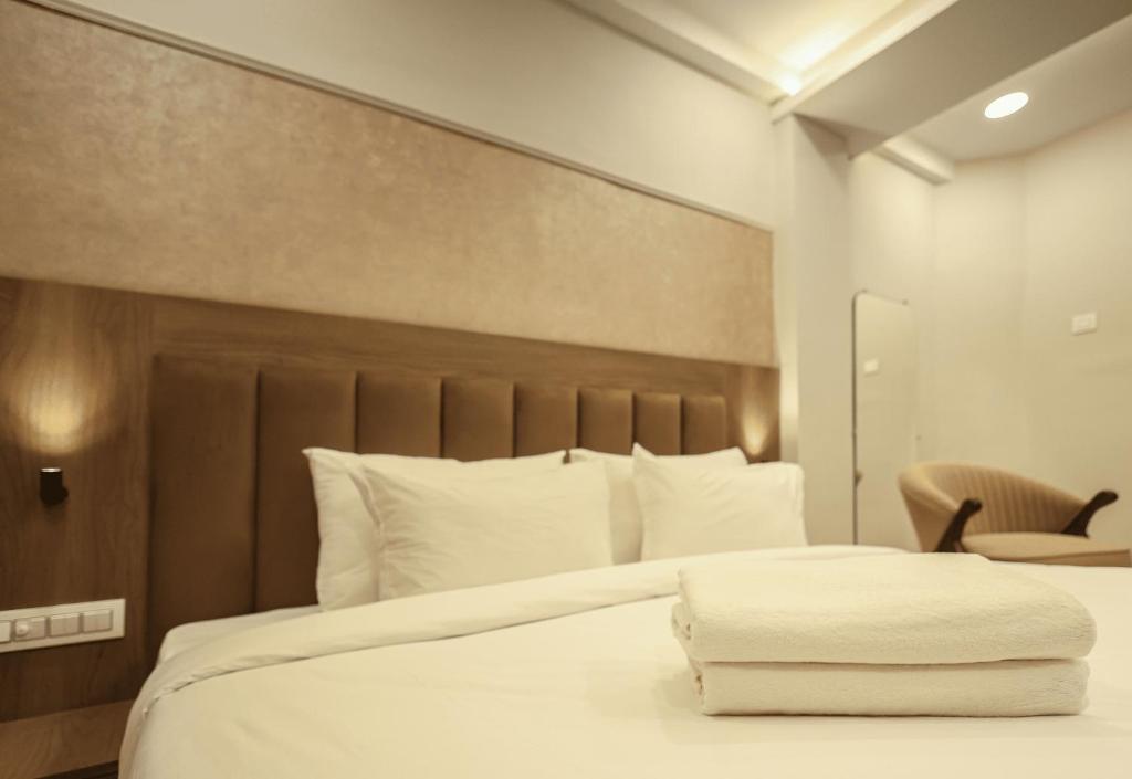 Postel nebo postele na pokoji v ubytování Arjun - A boutique hotel
