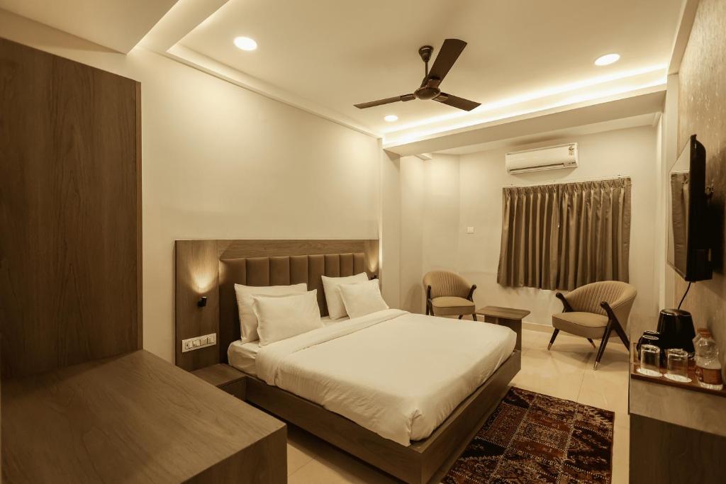 Ένα ή περισσότερα κρεβάτια σε δωμάτιο στο Arjun - A boutique hotel