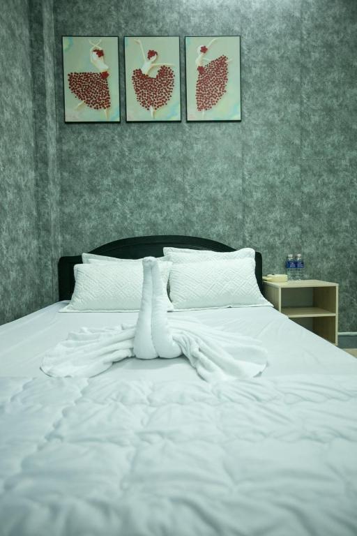 Postel nebo postele na pokoji v ubytování Nhà Nghỉ Kim Lài - Đối diện bệnh viện tỉnh Gia Lai -132 Tôn Thất Tùng