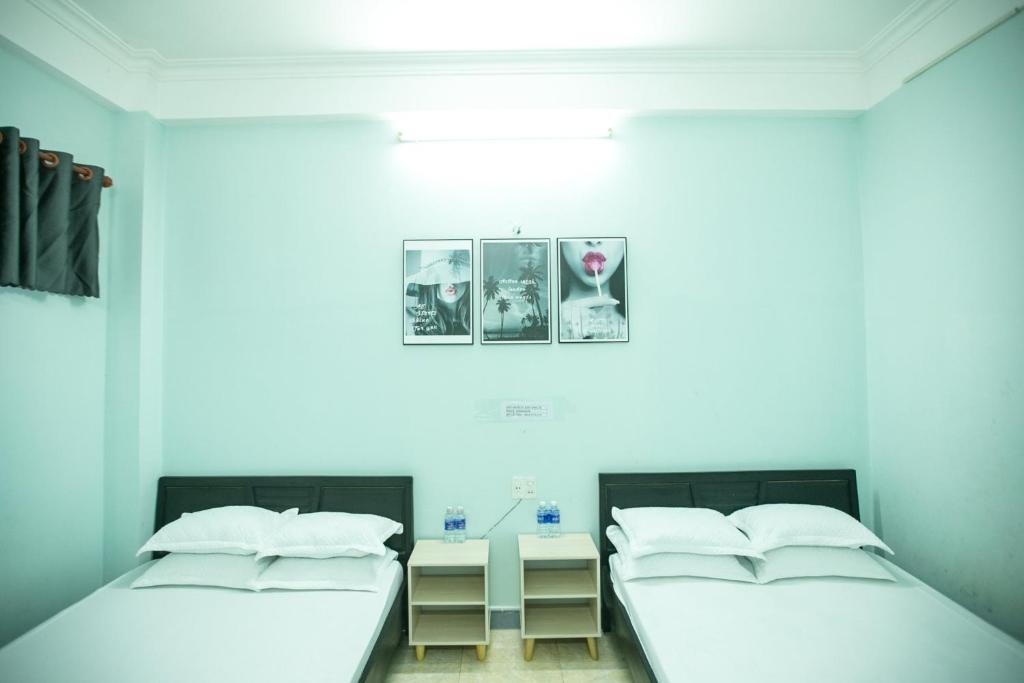 Postel nebo postele na pokoji v ubytování Nhà Nghỉ Kim Lài - Đối diện bệnh viện tỉnh Gia Lai -132 Tôn Thất Tùng