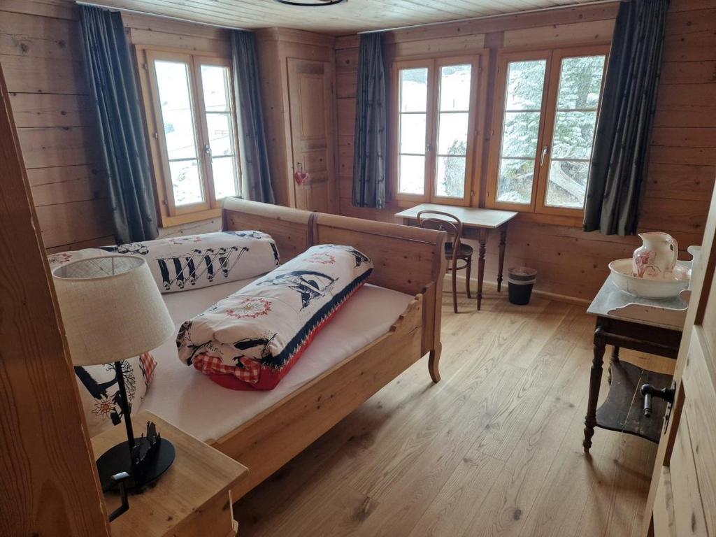 Postel nebo postele na pokoji v ubytování Alpenruh Kiental