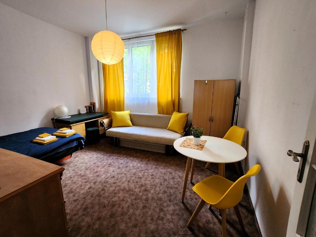 a small living room with a couch and a table at Studio Centrum, Private Entrance, SELF CHECK-IN 24h in Katowice