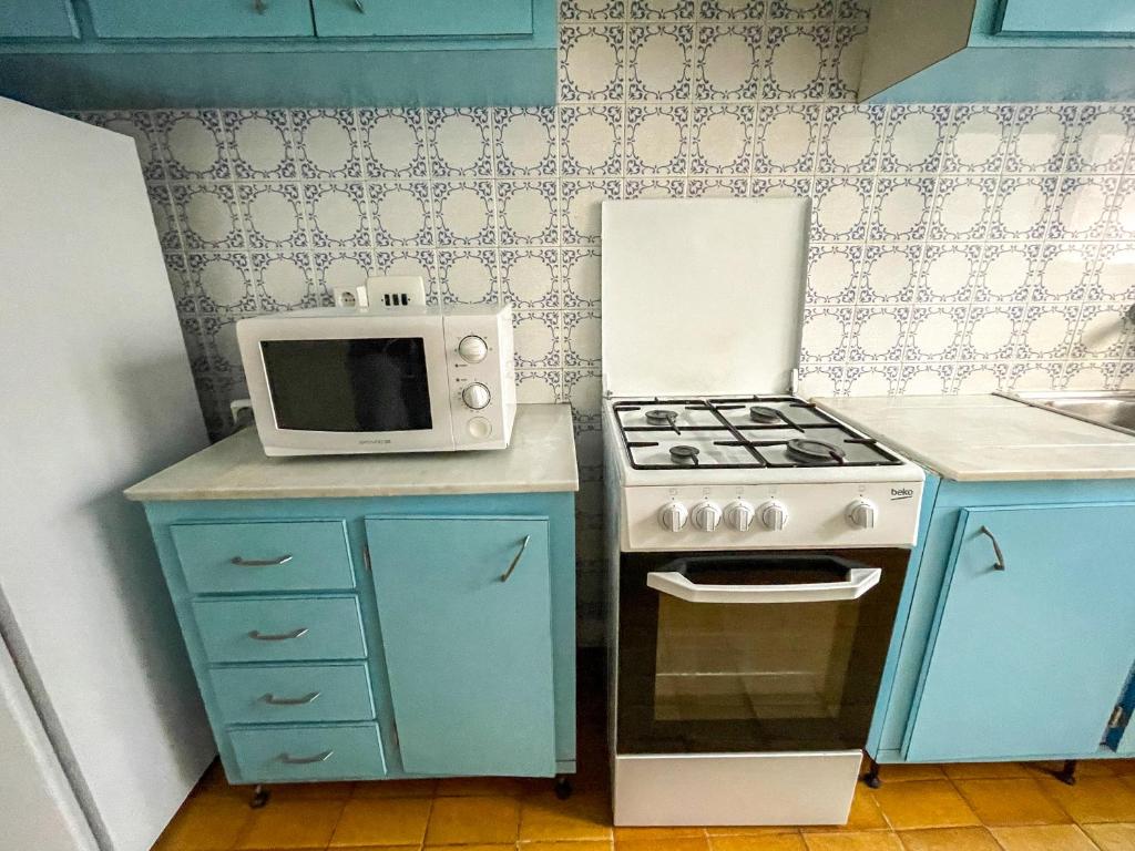 Kuchyň nebo kuchyňský kout v ubytování Apartamentos Gandia-Daimuz 3000
