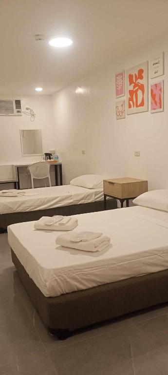 Postel nebo postele na pokoji v ubytování MAMORI HOTEL