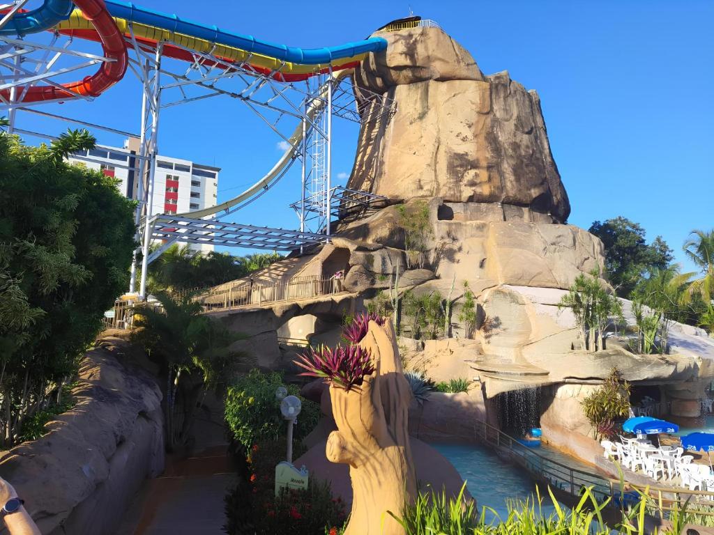 a roller coaster at the theme park at Piazza com acesso ao Acqua Park in Caldas Novas