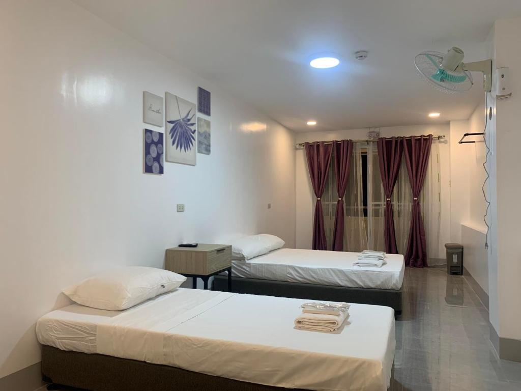 Postel nebo postele na pokoji v ubytování MAMORI HOTEL