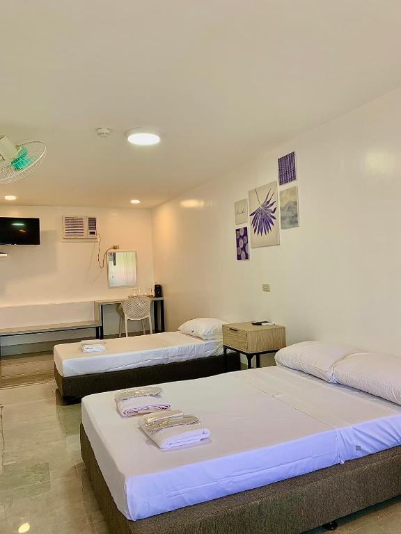 Postel nebo postele na pokoji v ubytování MAMORI HOTEL