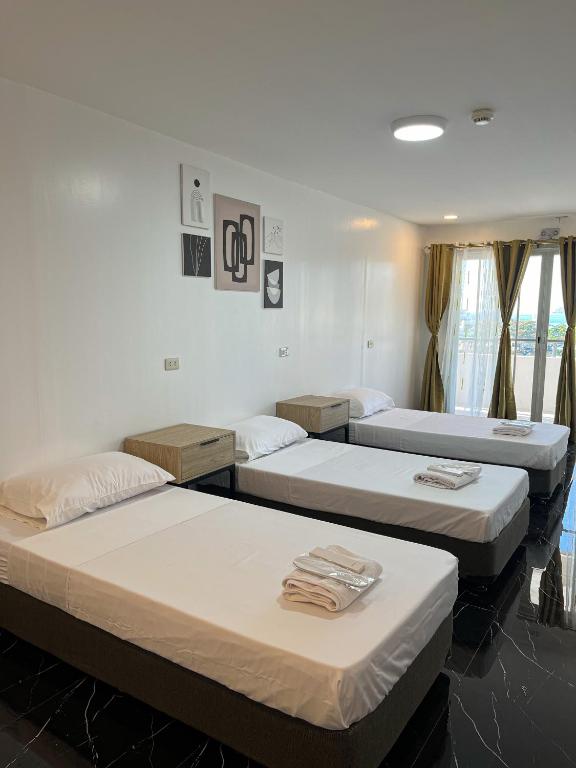 Postel nebo postele na pokoji v ubytování MAMORI HOTEL