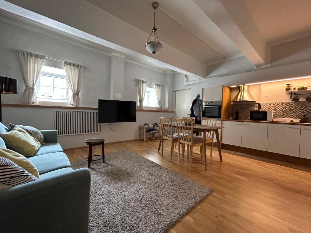 a living room with a couch and a table at Kivivete Apartaments in Pärnu