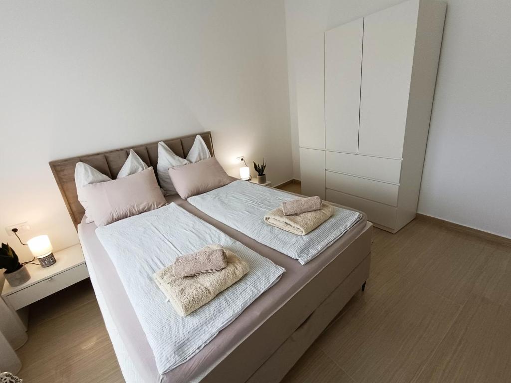 Postel nebo postele na pokoji v ubytování LUNA