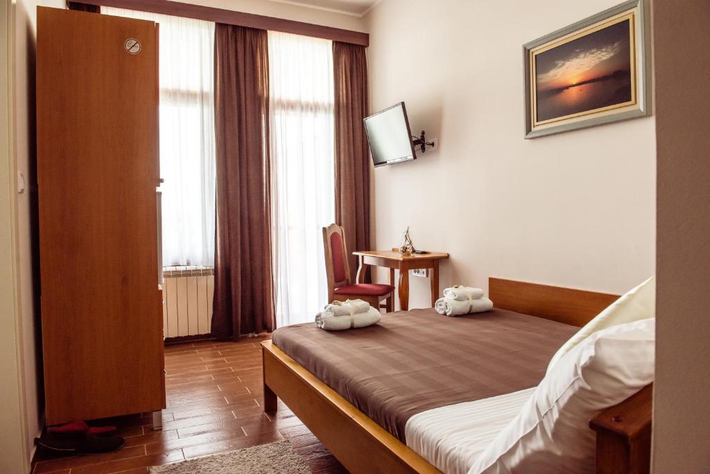 Postel nebo postele na pokoji v ubytování Posejdon Resort