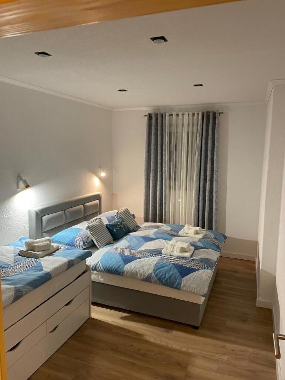 Postel nebo postele na pokoji v ubytování Apartments Vujina